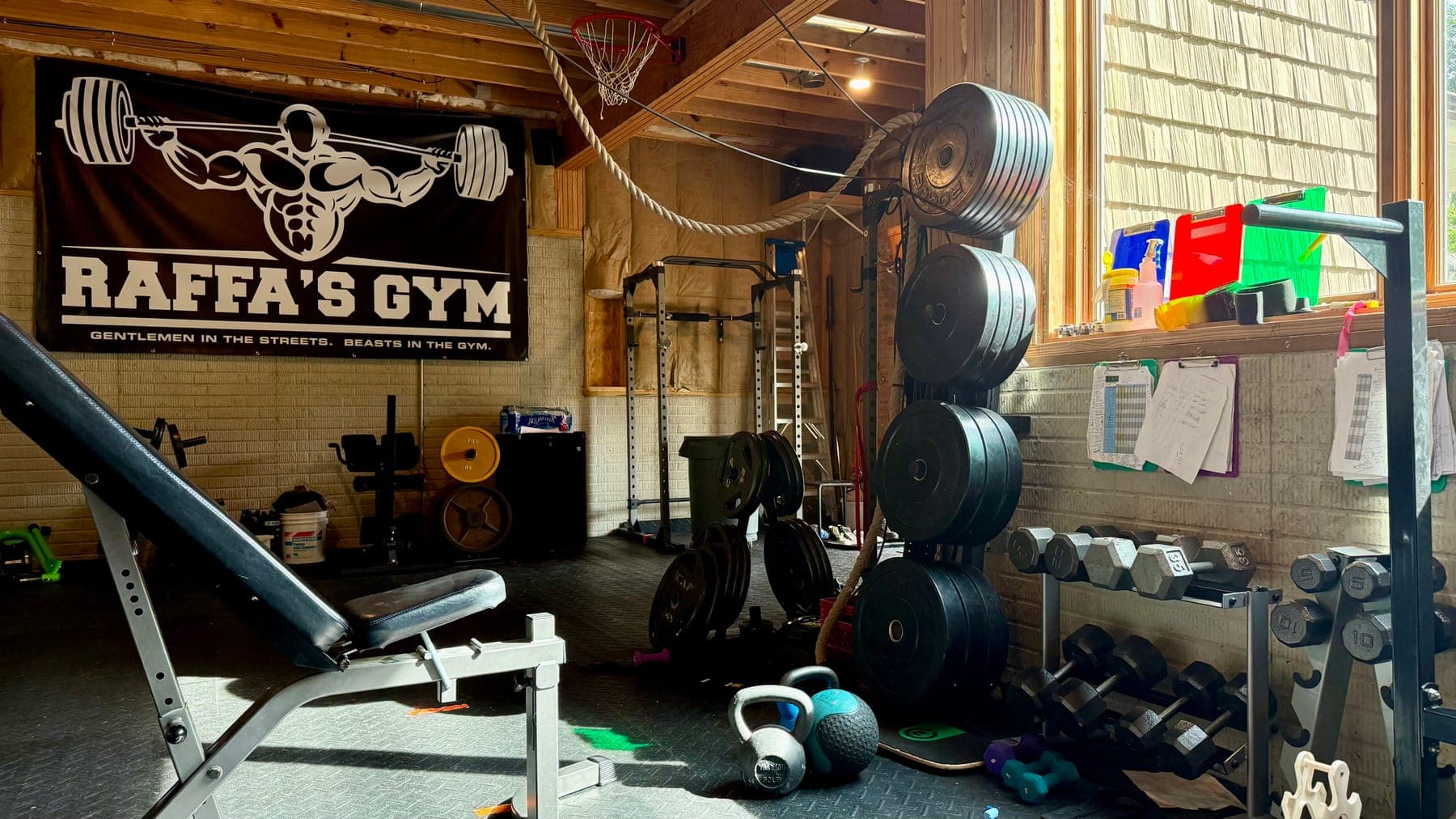 Inside Raffa's Gym, a SPOTTR partner floor with racks, plates and dumbbells